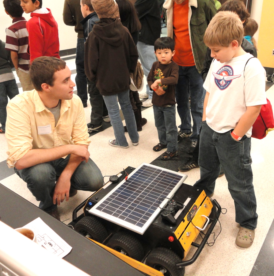 Explaining how solar panels recharge the robot's batteries.